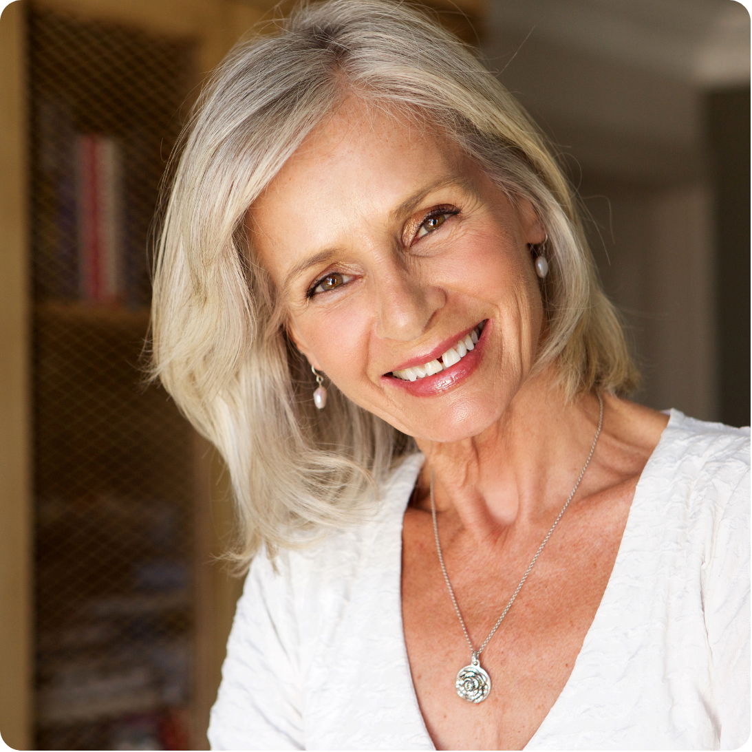 Portrait of the Potential Major Donor persona, an older woman in business casual attire